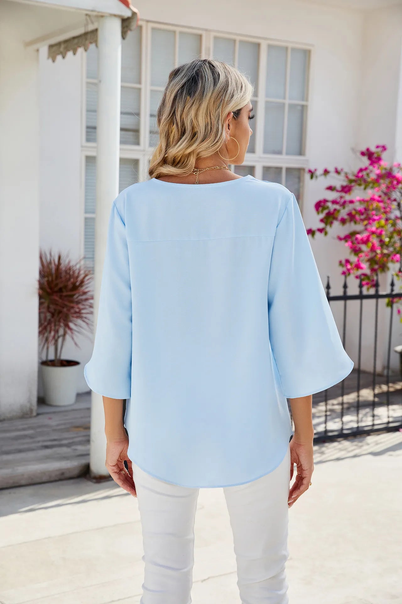 Caetana – Sheer blouse with short sleeves and V-neckline