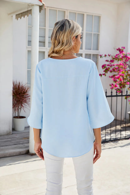 Caetana – Sheer blouse with short sleeves and V-neckline